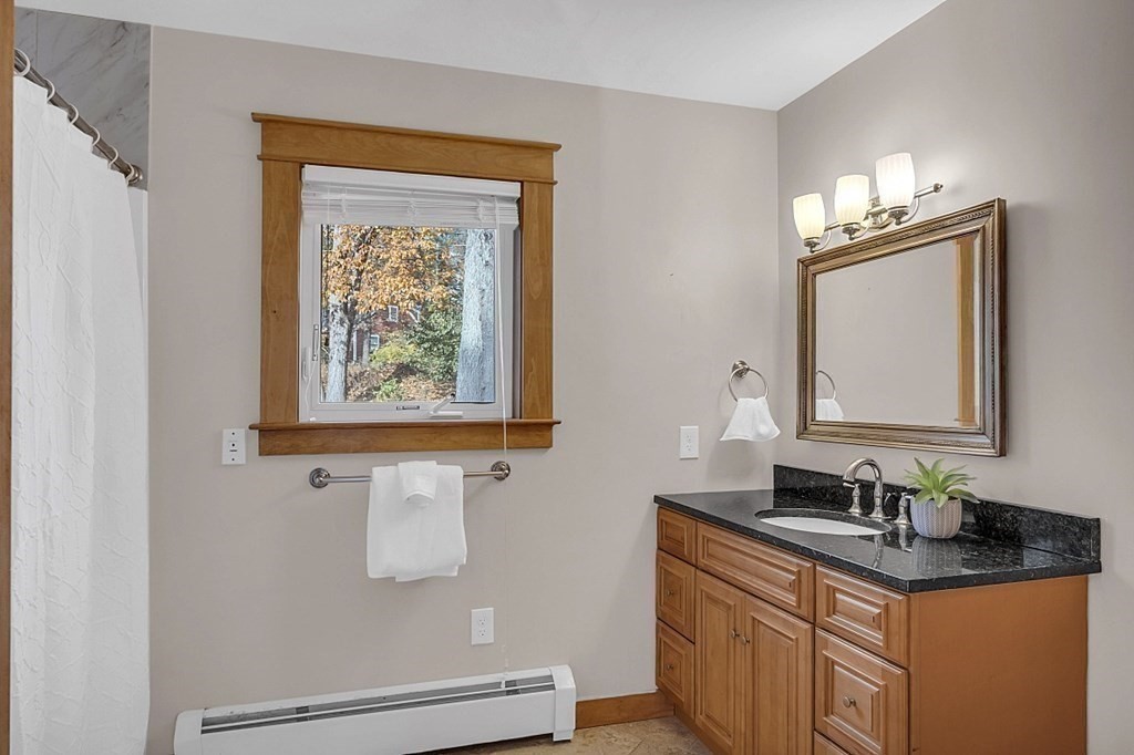 15 Stagecoach Road Topsfield, MA 01983 - Photo 30 of 40 a bathroom with a granite countertop sink a mirror and a