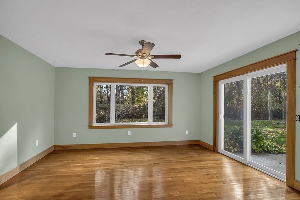 15 Stagecoach Road Topsfield, MA 01983 - Photo 31 of 40 a view of an empty room with wooden floor and a window