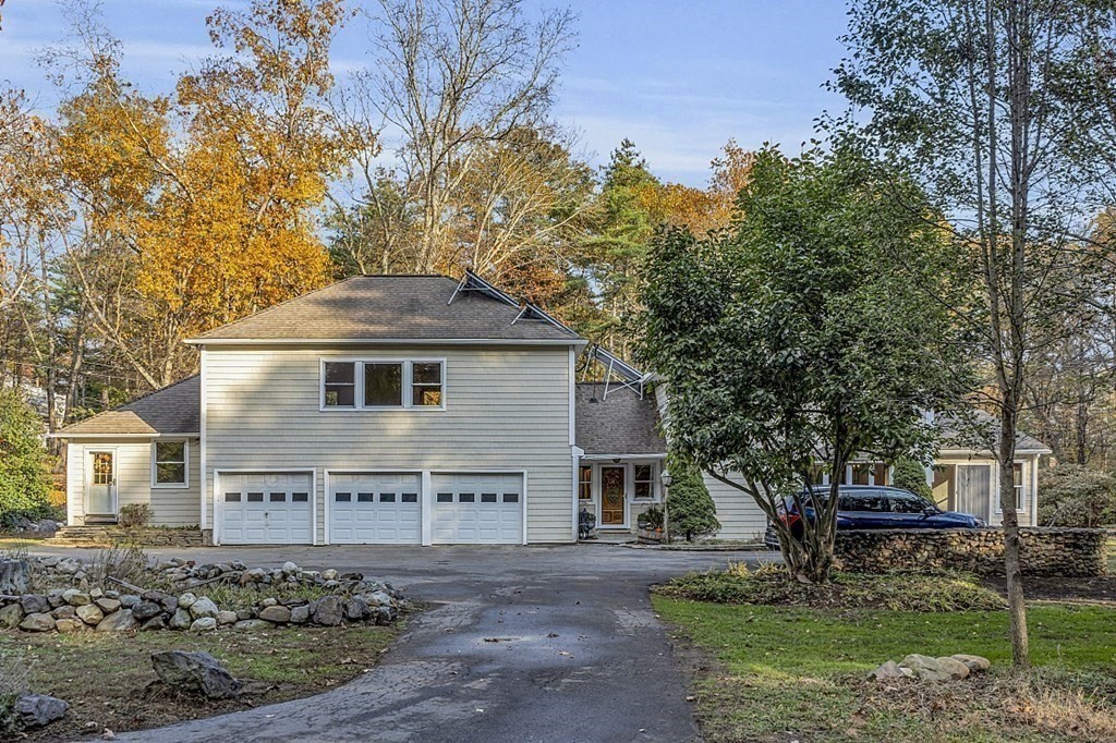 15 Stagecoach Road Topsfield, MA 01983 - Photo 35 of 40 a front view of a house with a garden