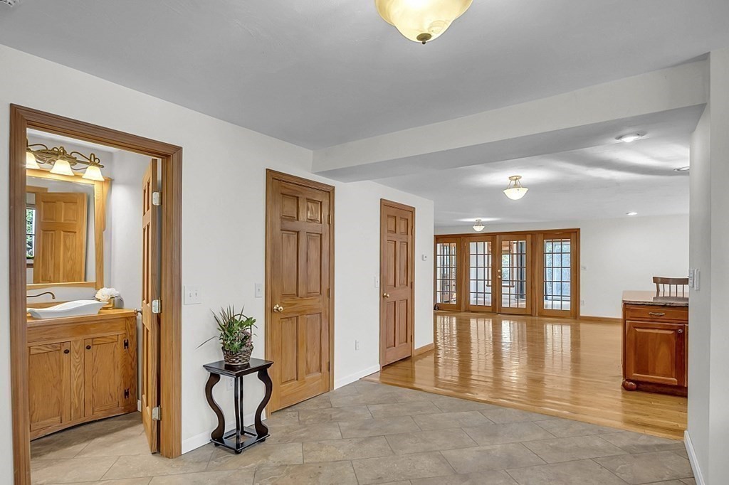 15 Stagecoach Road Topsfield, MA 01983 - Photo 5 of 40 a view of an entryway with wooden floor and a livingroom