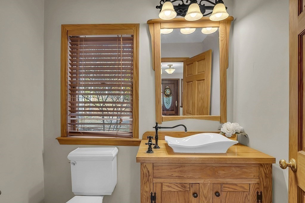 15 Stagecoach Road Topsfield, MA 01983 - Photo 6 of 40 a bathroom with a sink a toilet and mirror