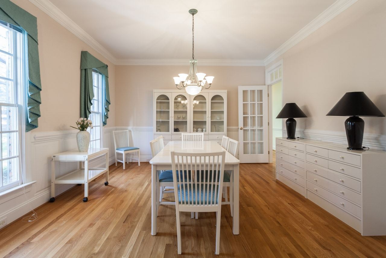 Large Dining Room with wood floors, Crown Molding, custom entry and transom opens you to your butlers pantry and expansive kitchen. Dining Room