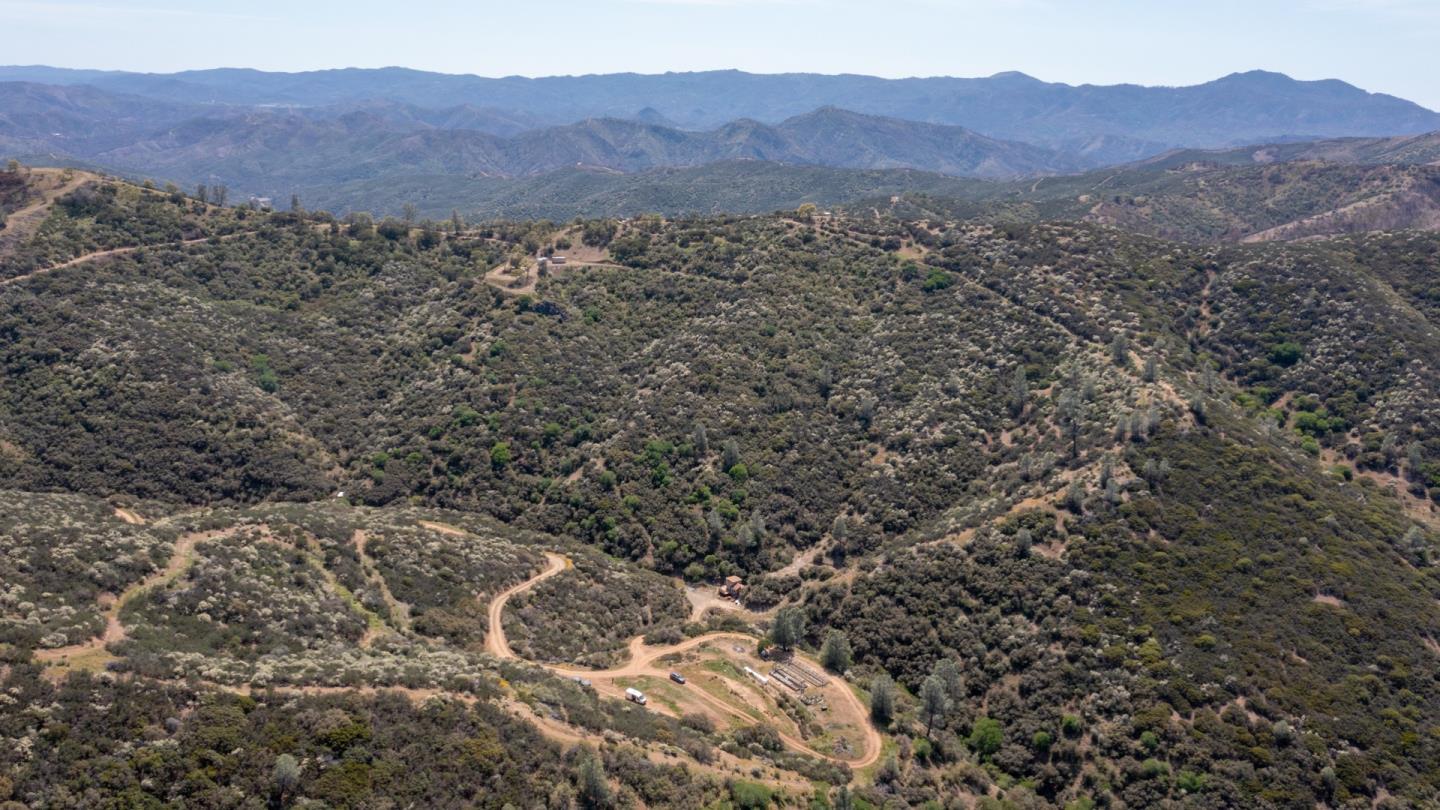 51541 Mines Road Livermore, CA 94550 - Photo 13 of 40 a view of a lush green hillside and a houses