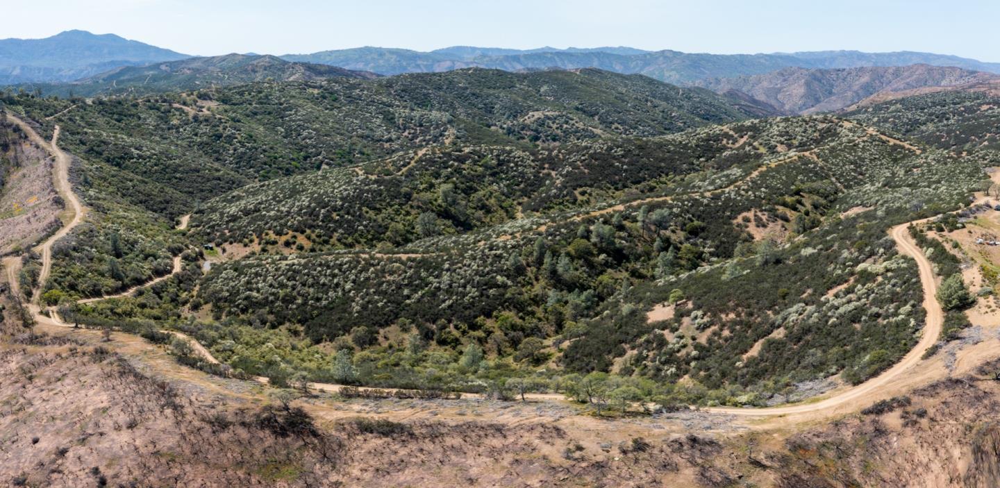 51541 Mines Road Livermore, CA 94550 - Photo 16 of 40 a view of a house with a mountain and a forest