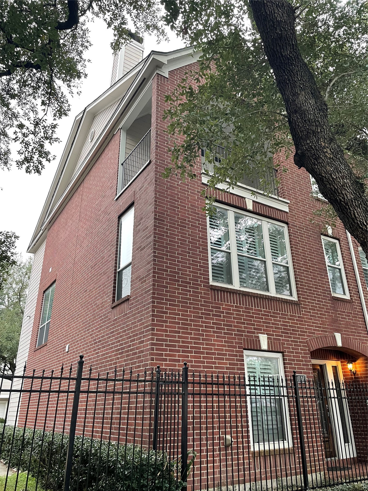 1040 La Rue Street Houston, TX 77019 - Photo 29 of 29 a view of a brick house with a large windows