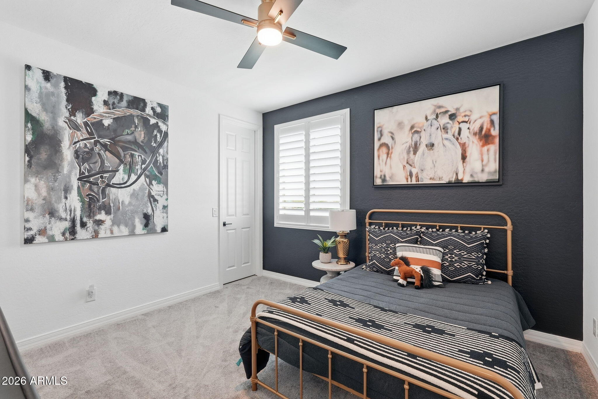 22607 East Russet Road Queen Creek, AZ 85142 - Photo 37 of 64 a bedroom with furniture and paintings on the wall