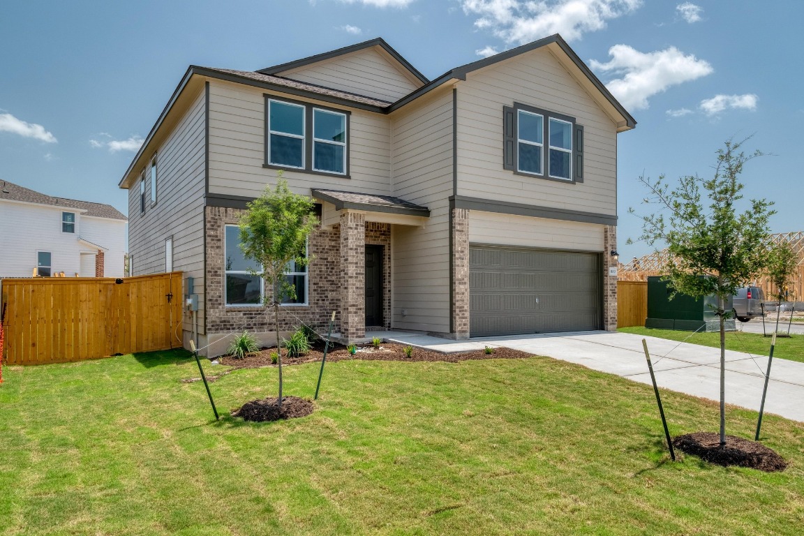 800 Yellow Ribbon Trail Jarrell, TX 76537 - Photo 2 of 32 a house view with a outdoor space