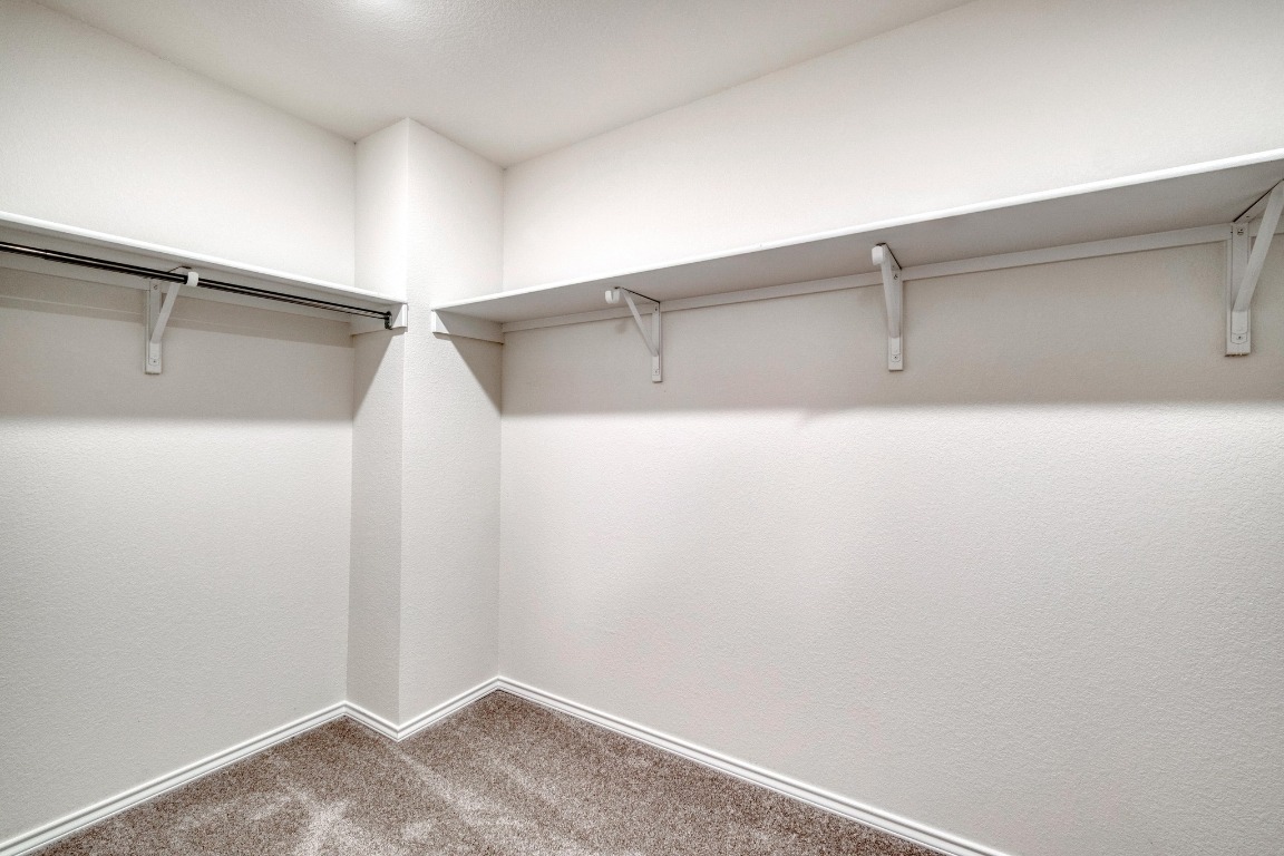 800 Yellow Ribbon Trail Jarrell, TX 76537 - Photo 23 of 32 a view of a room with racks on the wall