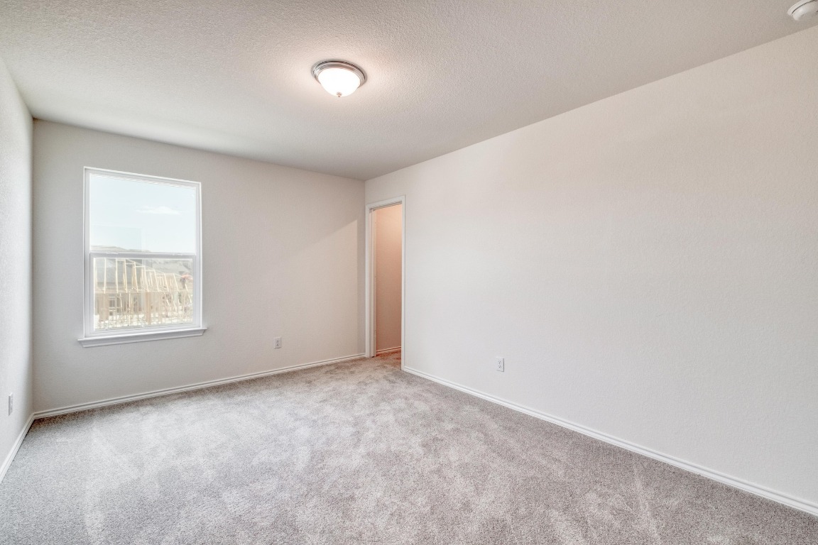 800 Yellow Ribbon Trail Jarrell, TX 76537 - Photo 24 of 32 an empty room with a window