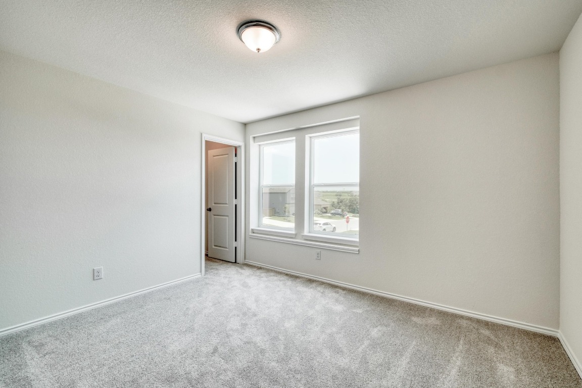 800 Yellow Ribbon Trail Jarrell, TX 76537 - Photo 25 of 32 an empty room with a window
