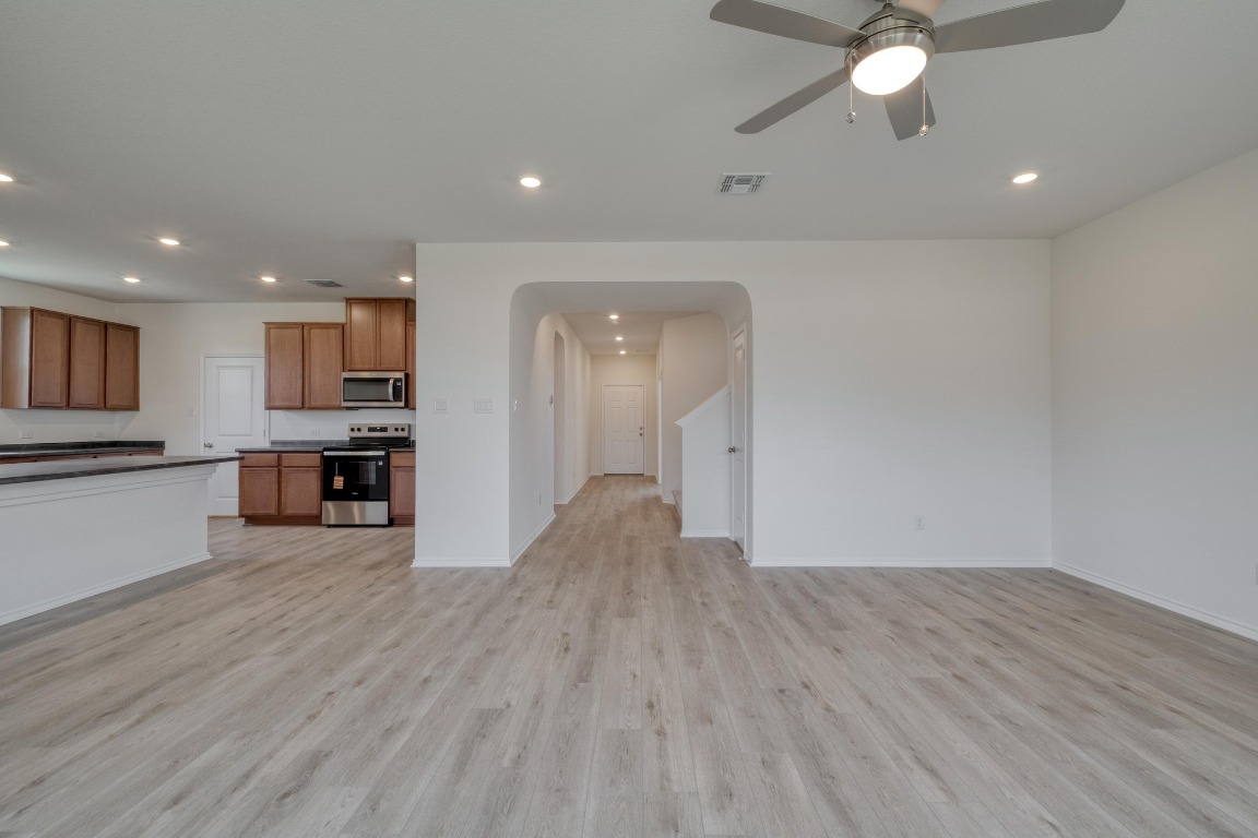 800 Yellow Ribbon Trail Jarrell, TX 76537 - Photo 6 of 32 a view of a kitchen with a sink and a stove top oven