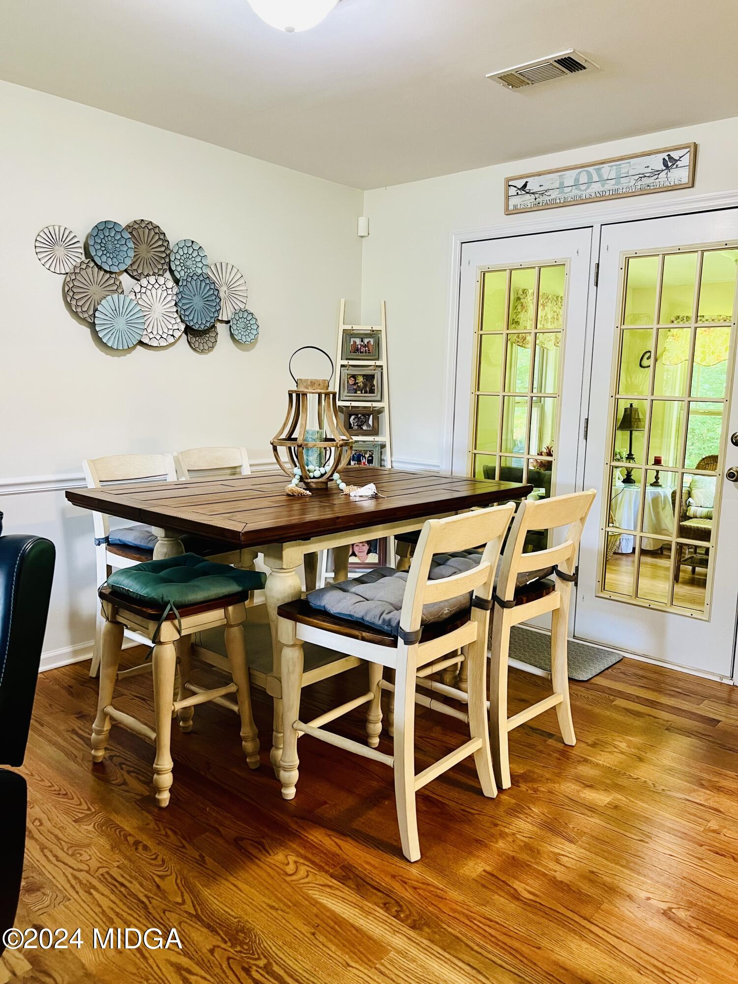 25 Ruby Road Jackson, GA 30233 - Photo 12 of 29 a dining room with furniture a large window and wooden floor