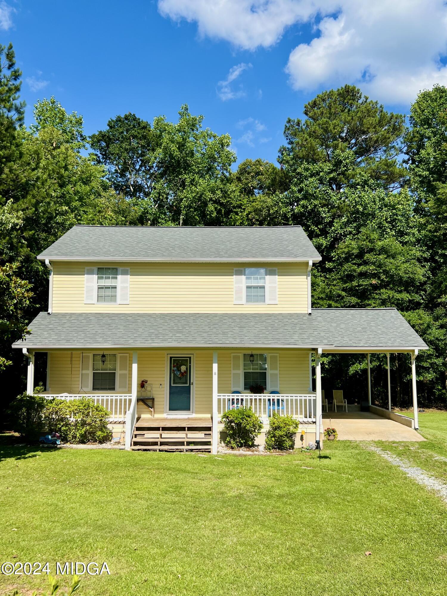 25 Ruby Road Jackson, GA 30233 - Photo 2 of 29 a front view of a house with a garden