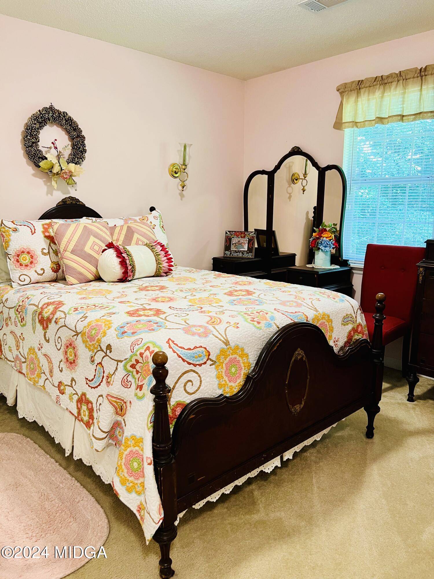 25 Ruby Road Jackson, GA 30233 - Photo 26 of 29 a bedroom with a bed and window