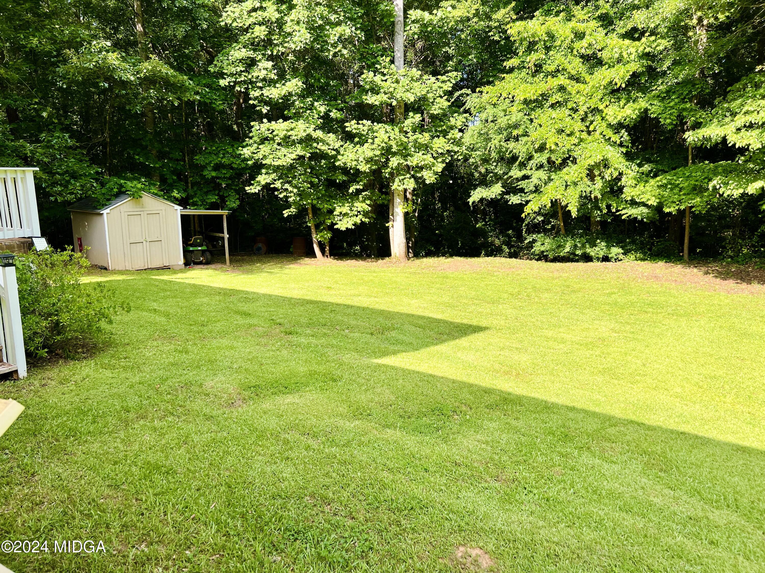 25 Ruby Road Jackson, GA 30233 - Photo 7 of 29 a view of a swimming pool and trees in the background