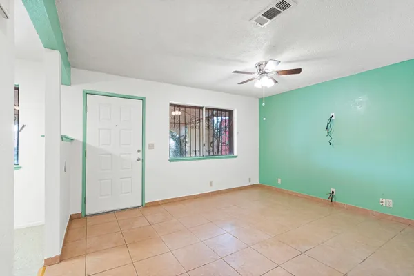 a view of an empty room with a window