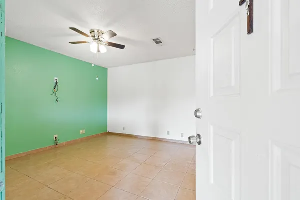 a view of a room that has a fan and a fan