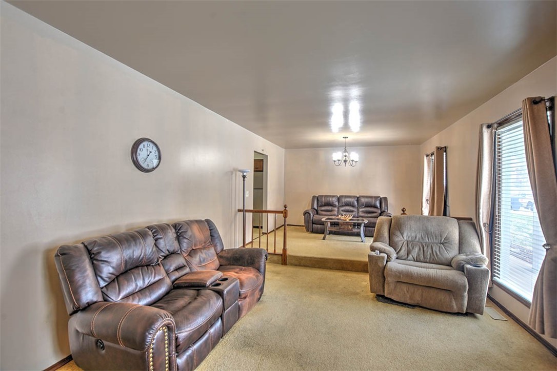 4425 Butler Drive Decatur, IL 62526 - Photo 5 of 22 a living room with furniture and a chandelier