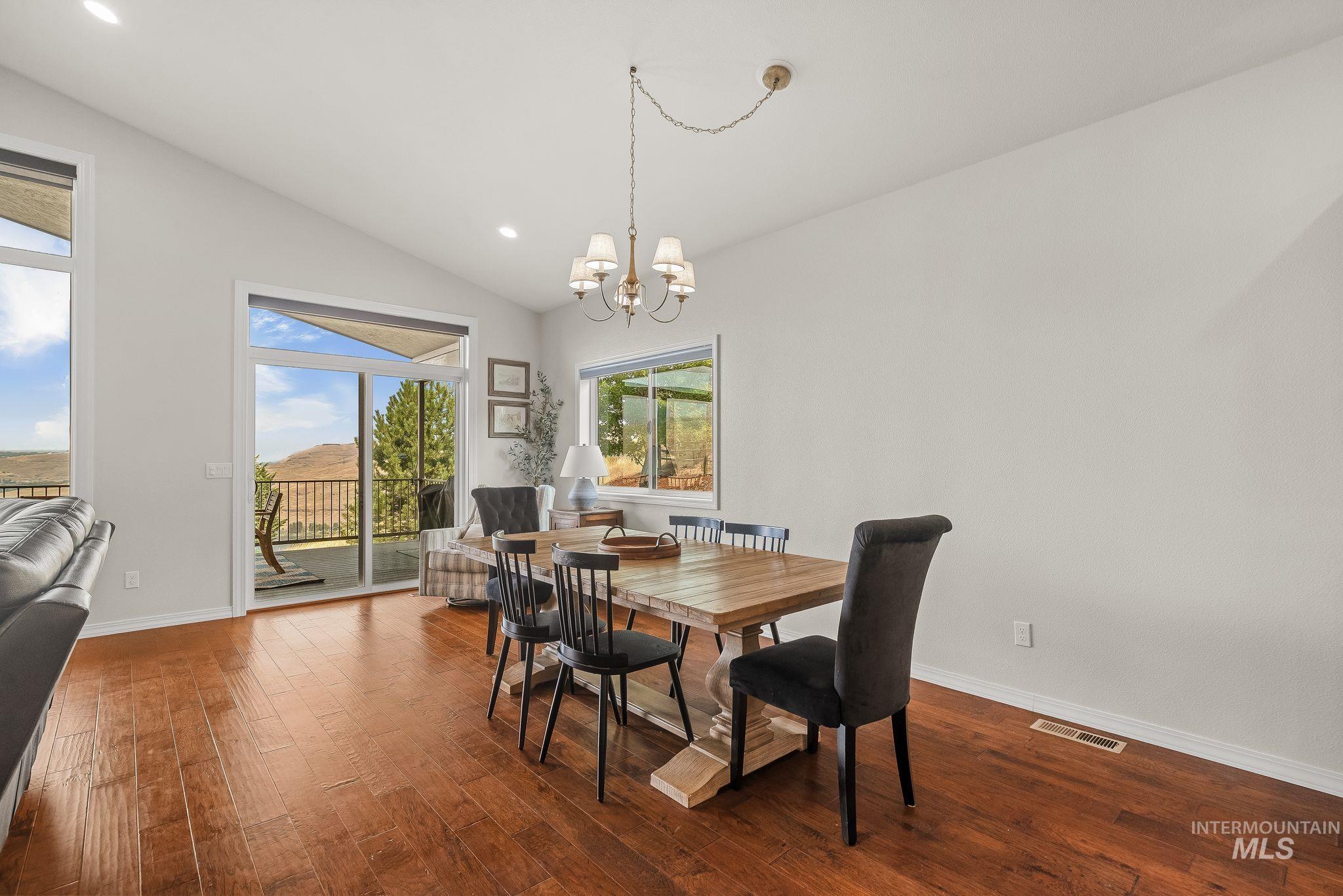 602 Quarry Road Asotin, WA 99402 - Photo 16 of 49 Spacious dining area featuring wood-finish flooring, vaulted ceilings, and recessed lighting