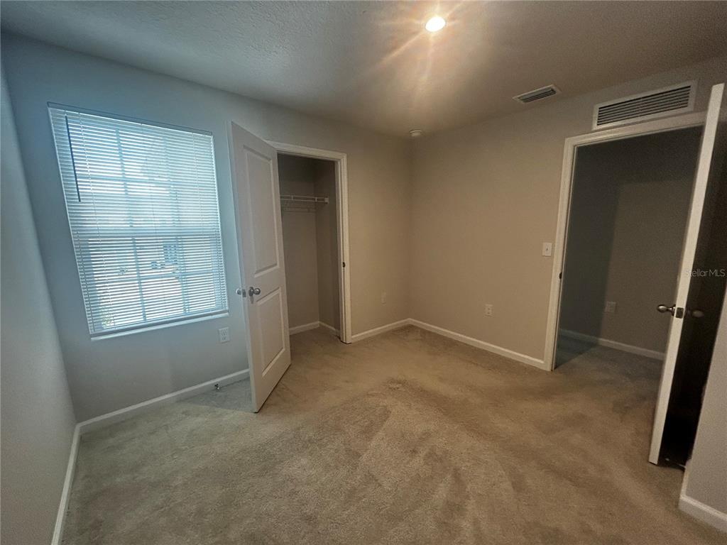 14124 Crimson Avenue Bradenton, FL 34211 - Photo 11 of 27 an empty room with windows