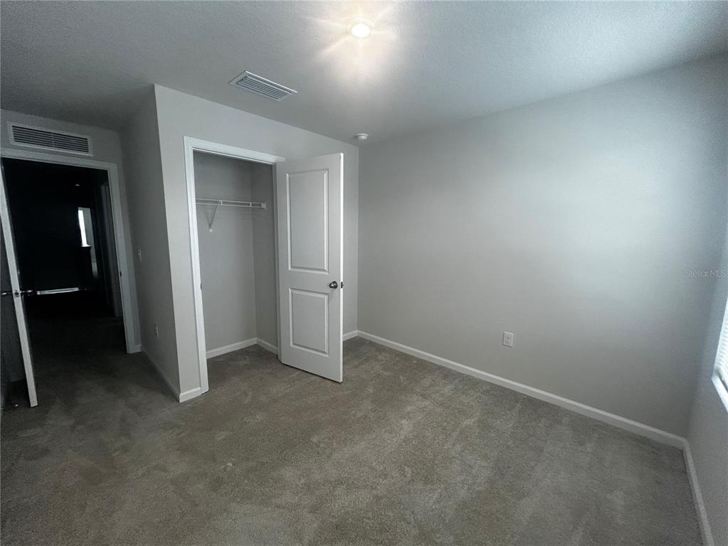 14124 Crimson Avenue Bradenton, FL 34211 - Photo 9 of 27 an empty room with closet area