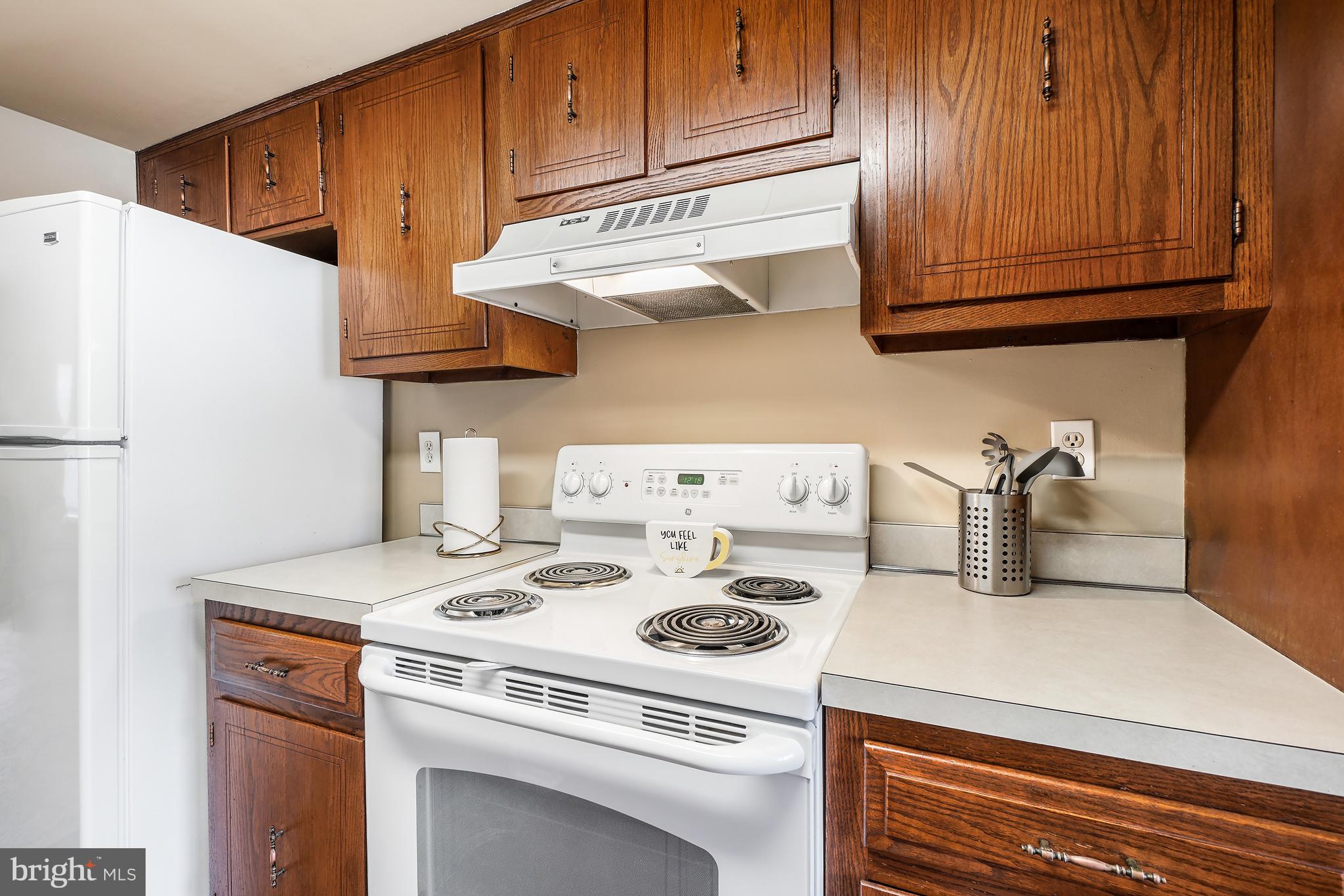 3136 Adderley Court, Unit 243G Silver Spring, MD 20906 - Photo 6 of 41 Kitchen with White Appliances