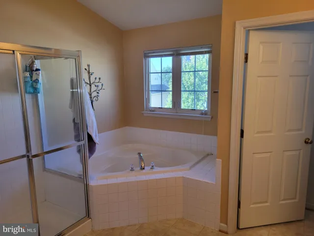 a white bath tub sitting in a bathroom