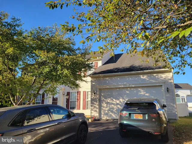 a car parked in front of a house