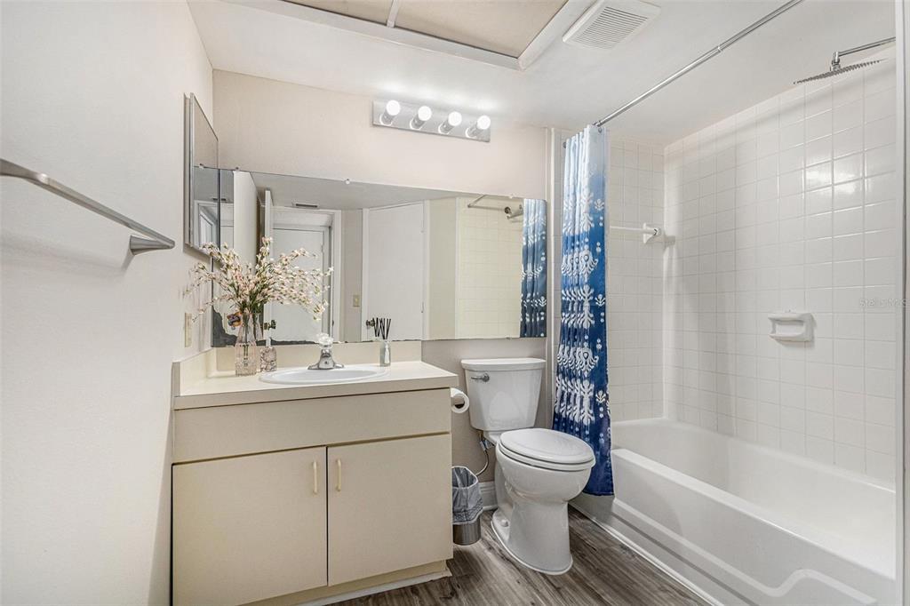 315 Lakepointe Drive, Unit 104 Altamonte Springs, FL 32701 - Photo 16 of 20 a bathroom with a sink toilet a mirror and shower