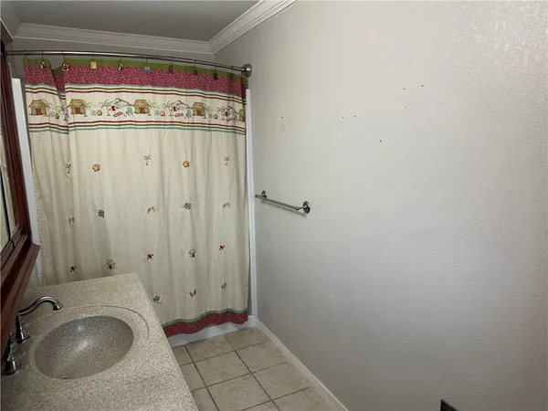 a view of a utility room with cabinet washer and dryer