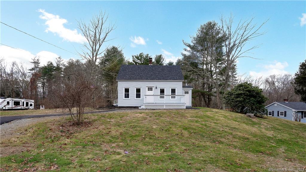 829 Bailey Hill Road Killingly, CT 06241 - Photo 1 of 1 a front view of a house with a yard and garage