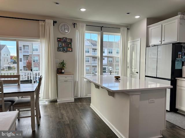 35 Stanton Road Mount Holly, NJ 08060 - Photo 20 of 49 a kitchen with stainless steel appliances granite countertop a refrigerator a stove and a dining table with wooden floor
