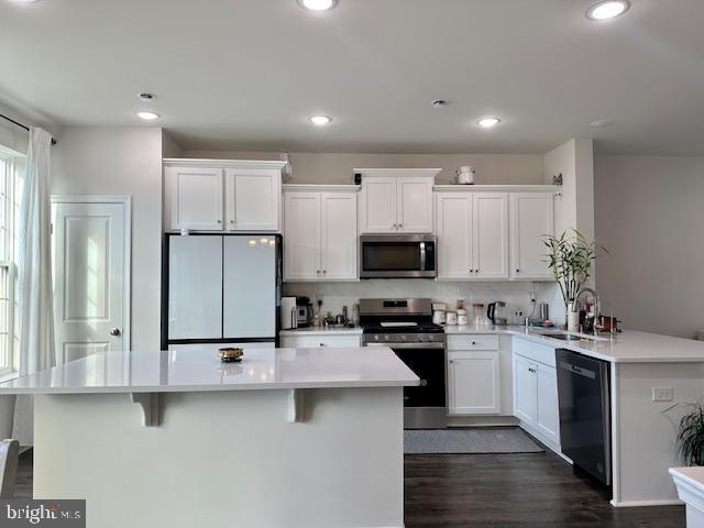 35 Stanton Road Mount Holly, NJ 08060 - Photo 26 of 49 a kitchen with a sink a counter top space stainless steel appliances and cabinets