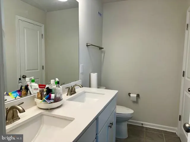a view of a livingroom with a refrigerator