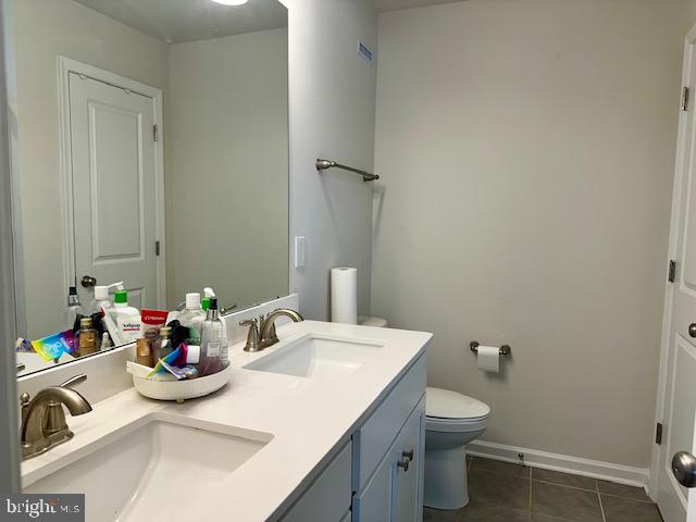 35 Stanton Road Mount Holly, NJ 08060 - Photo 37 of 49 a bathroom with a sink toilet and a mirror