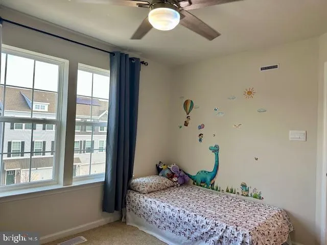 a bathroom with a sink a toilet a mirror and shower curtain