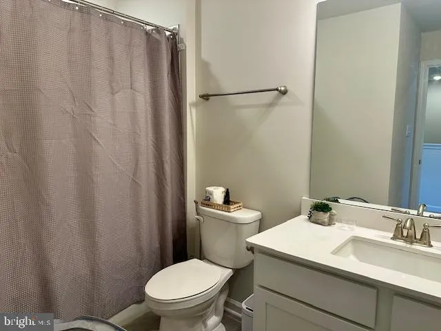 a view of a house with a yard in front of it