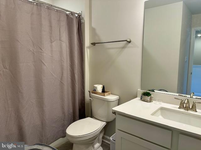 35 Stanton Road Mount Holly, NJ 08060 - Photo 46 of 49 a bathroom with a sink a toilet a mirror and shower curtain