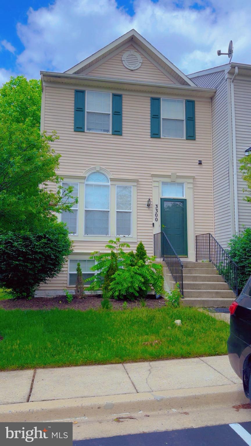 3300 Yellow Flower Road Laurel, MD 20724 - Photo 1 of 20 a front view of a house with a yard and garage