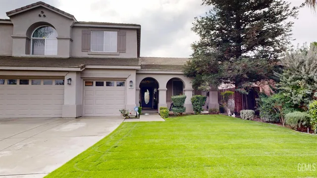 a view of a front of a house with a yard