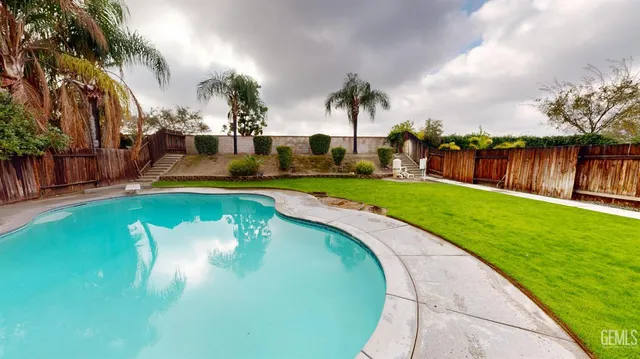 a view of a swimming pool with a garden
