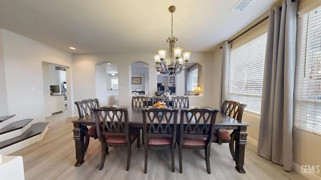a view of a dining room with furniture and window