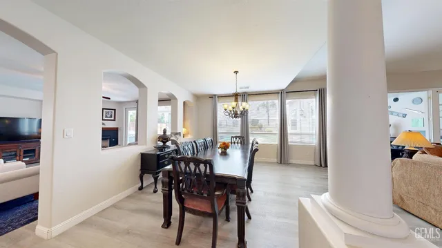 a view of a dining room with furniture and window
