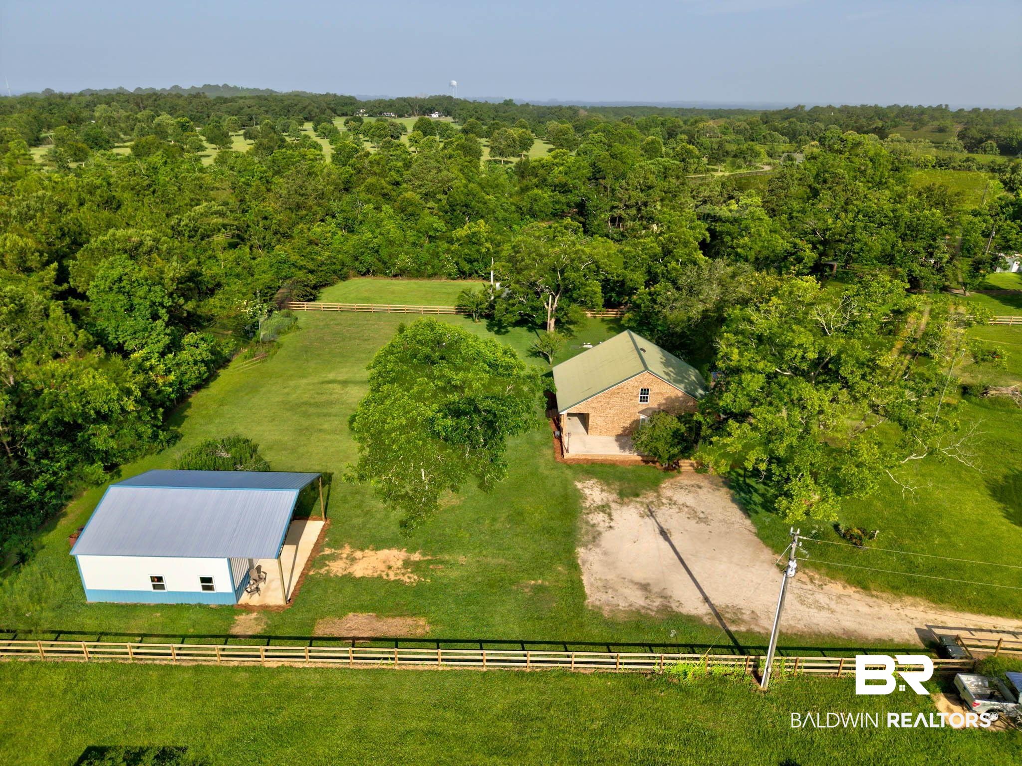 7564 Rabbit Run Road Fairhope, AL 36532 - Photo 69 of 88 Aerial view of sparsely populated area with a forest