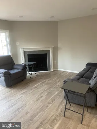 a living room with furniture and a piano