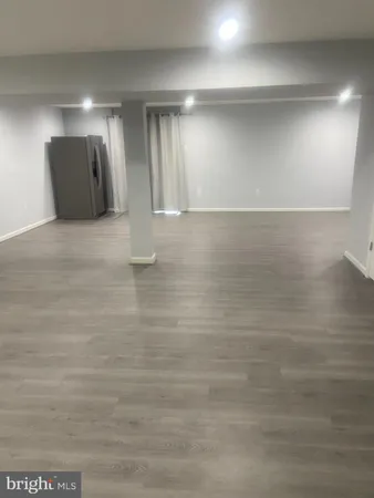 a view of a big room with wooden floor