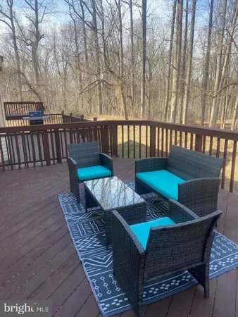 a view of balcony with wooden floor