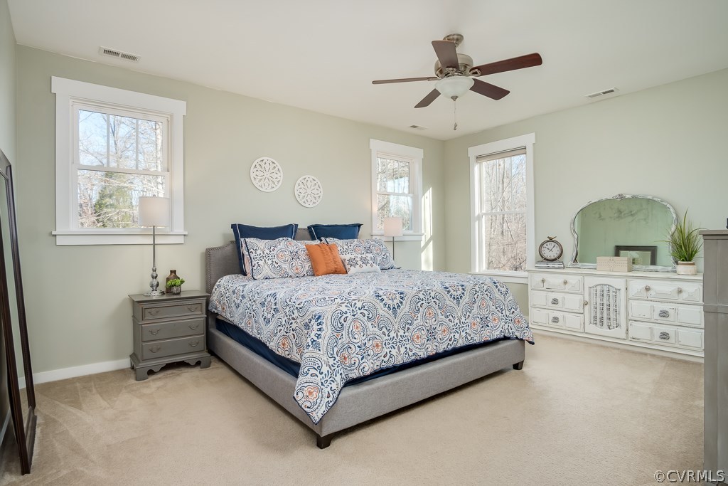16006 Alsdell Road Midlothian, VA 23112 - Photo 26 of 46 a bedroom with a large bed and windows