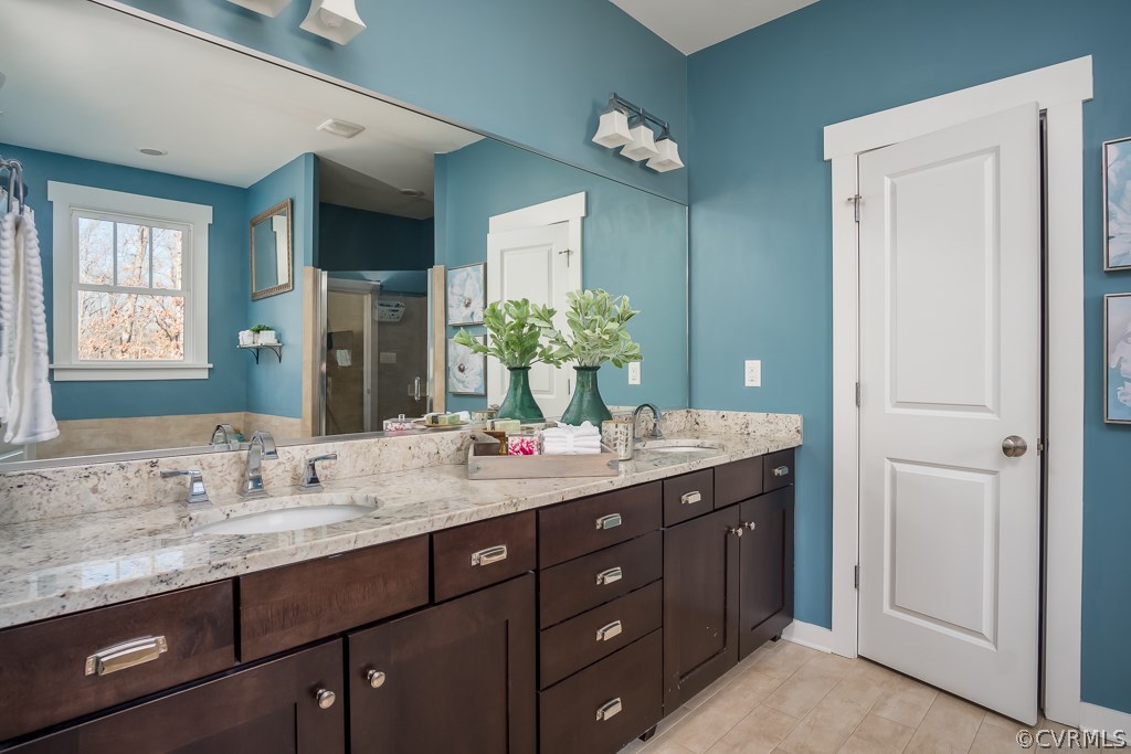 16006 Alsdell Road Midlothian, VA 23112 - Photo 29 of 46 a bathroom with a granite countertop double vanity sink and a mirror