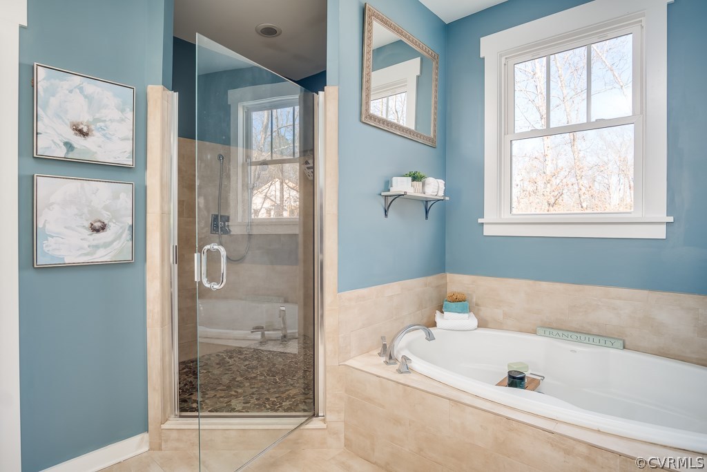 16006 Alsdell Road Midlothian, VA 23112 - Photo 30 of 46 a bathroom with a tub a sink and a shower